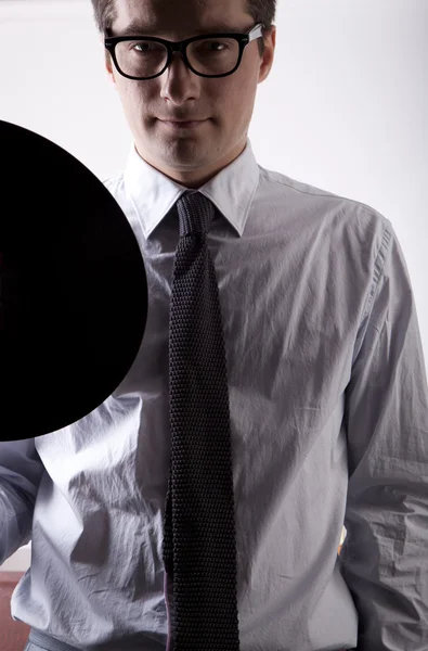 Stock image Young man holding vinyl LP