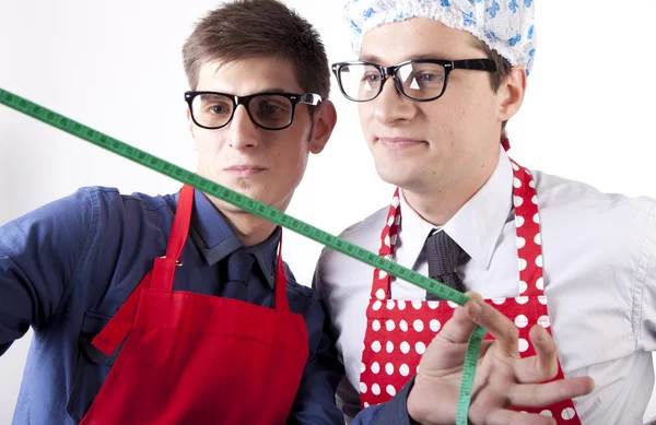 Two men with measuring tape — Stock Photo, Image