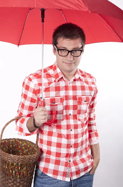 Young man with red umbrella — Stock Photo, Image