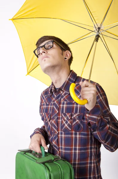 Young man with yellow umbrella — Stock Photo, Image