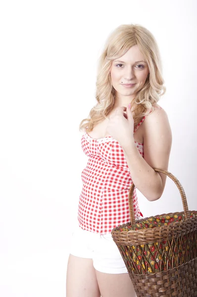 Young attractive woman holding a basket — Stock Photo, Image