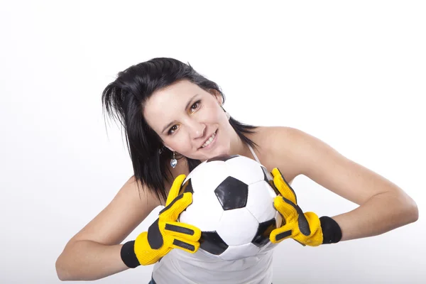 Girl holding a football. — Stock Photo, Image