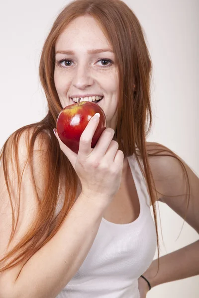 Young beautiful girl eating apple — Stock Photo, Image