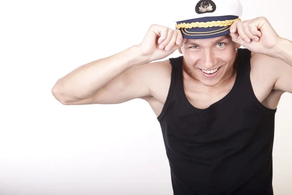 Çekici genç bir adam denizci şapkası — Stok fotoğraf