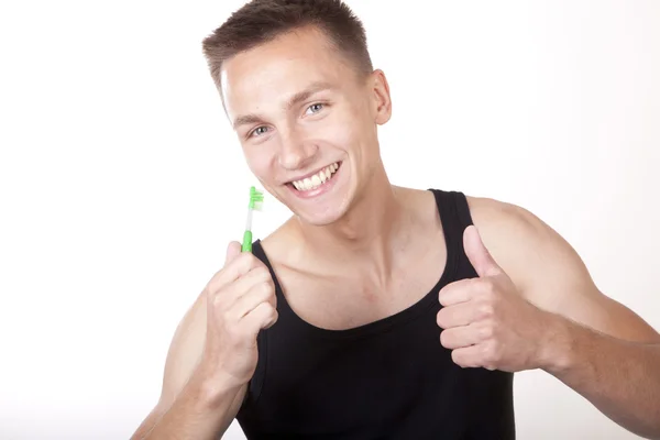 Attraktiv ung med tandborste — Stockfoto