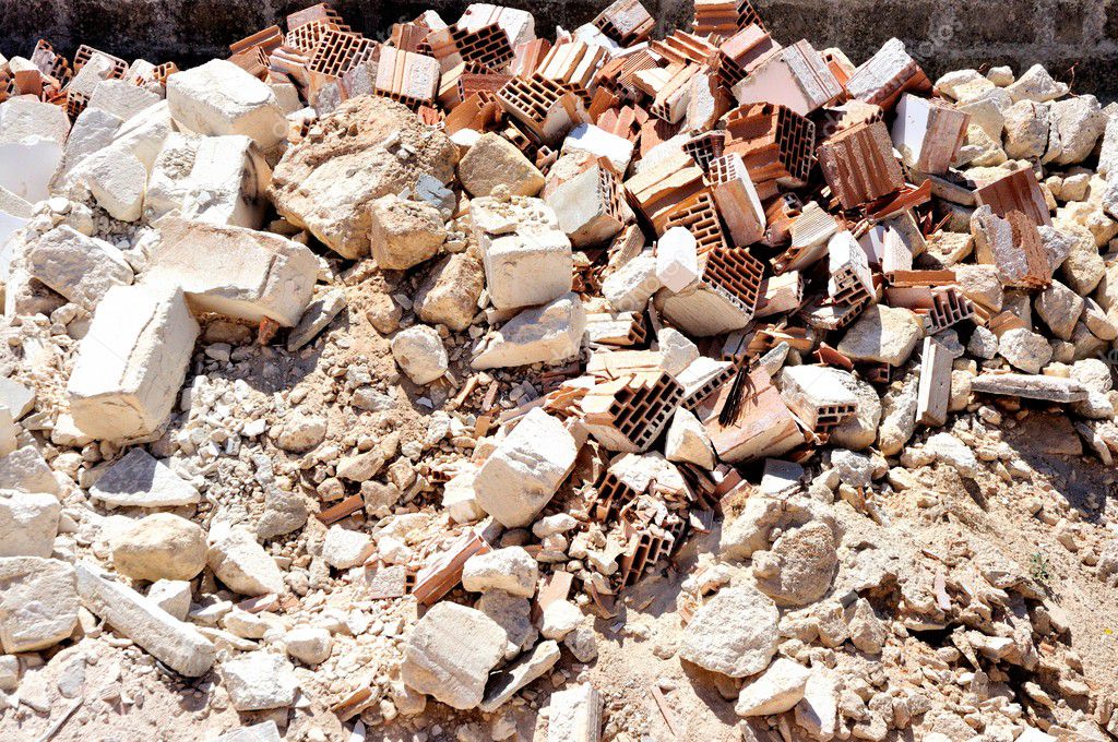Rubble and debris of brick walls of brick as a result of demolition of building