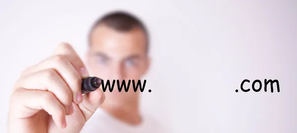 Man writing the name of the site — Stock Photo, Image