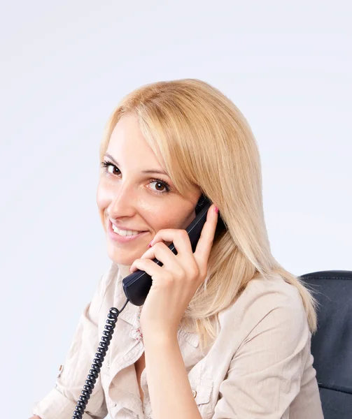 stock image Portrait of a young blonde girl on the phone