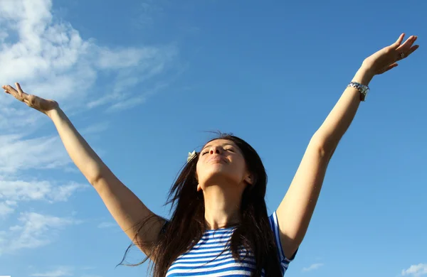 stock image Pretty young woman with arms raised