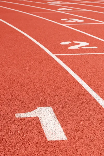 Křivka běžecká dráha s čísly lane — Stock fotografie