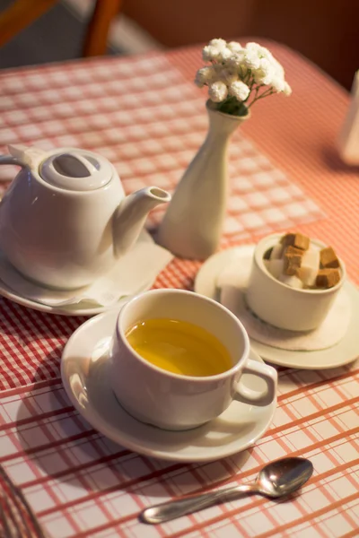 stock image Cup of green tea with teapot