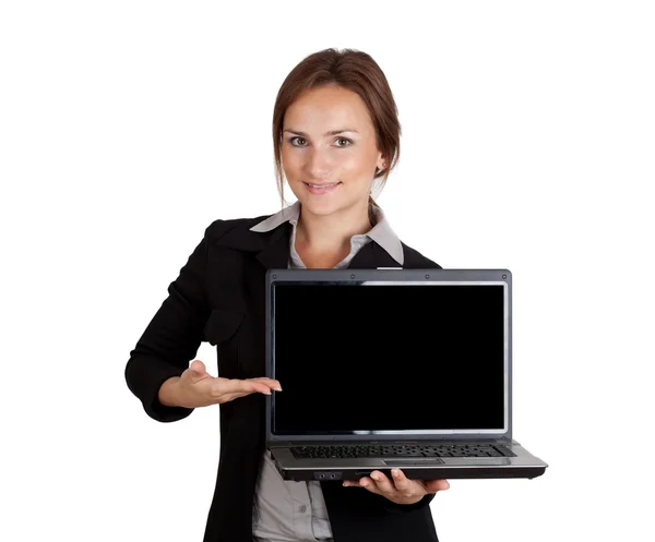 Geschäftsfrau zeigt auf Laptop Stockbild