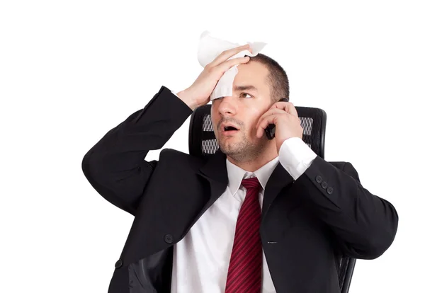Businessman holding forehead — Stock Photo, Image