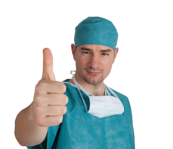 Doctor in scrubs thumb up — Stok fotoğraf