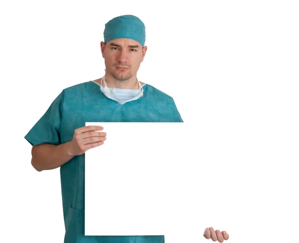 Doutor em esfrega com placa em branco — Fotografia de Stock