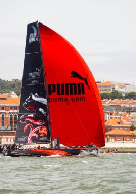 LISBON, PORTUGAL - JUNE 9: Puma Ocean Racing Powered by Berg Propulsion in Volvo Ocean Race - Lisbon StopOver - Harbour Race June 9, 2012 in Lisbon, Portugal clipart