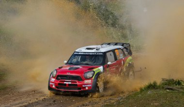 ALGARVE, PORTUGAL - MARCH 31: Dani Sordo (ESP) driving is Mini Cooper Works WRC in Rally de Portugal 2012 on March 31, 2012 in Algarve, Portugal clipart