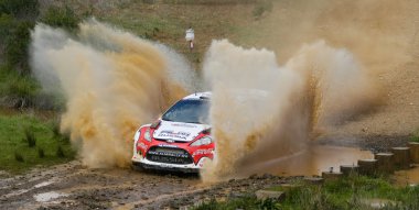 ALGARVE, PORTUGAL - MARCH 31: Evgeny Novikov (RUS) driving is Ford Fiesta RS WRC in Rally de Portugal 2012 on March 31, 2012 in Algarve, Portugal clipart