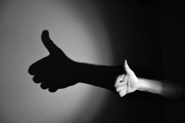 Hand shadow of good work,black and white clipart