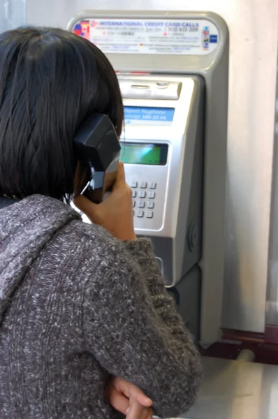 stock image Using a public phone