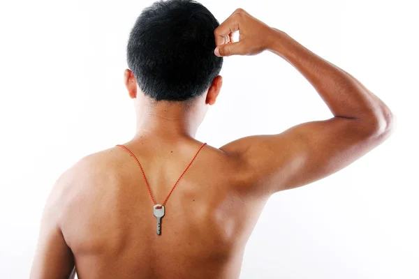 Man Muscle with key necklace — Stock Photo, Image