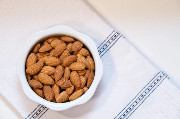 Almonds in bowl — Stock Photo, Image