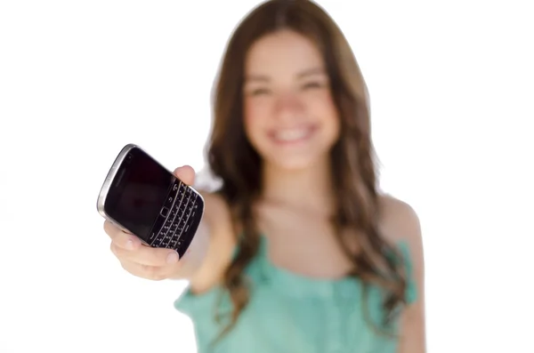 Cute young woman passing a cell phone to take a call — Stock Photo, Image