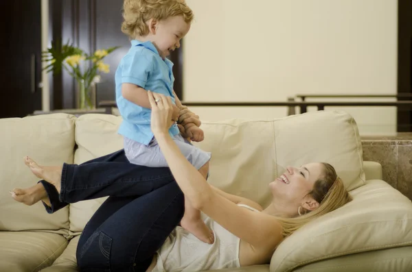 Cute young mother and son having fun together — Stock Photo, Image