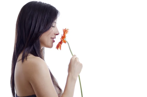 Young happy woman smelling a flower she just got from her date — Stock Photo, Image