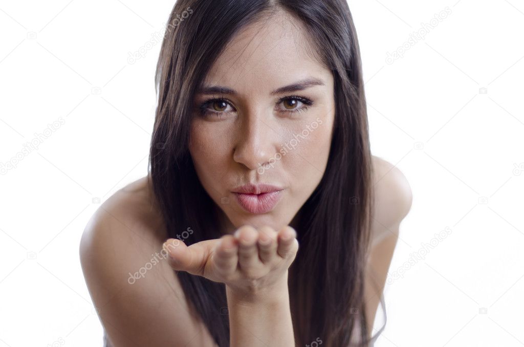 Cute flirty woman blowing a kiss