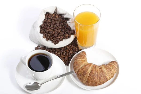 Café da manhã francês de xícara de café com suco de laranja e croissant — Fotografia de Stock
