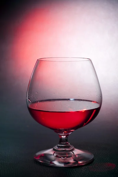 Luxury red liqueur on balloon crysal glass — Stock Photo, Image
