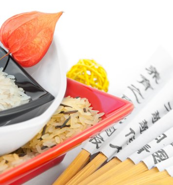 Rice in multi-colored plates clipart