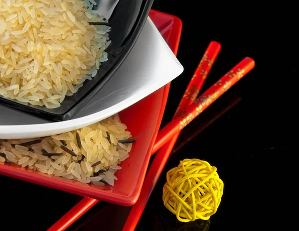 stock image Rice in multi-colored plates