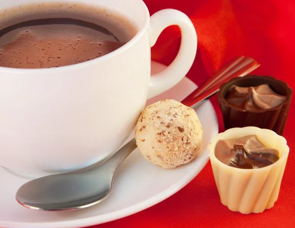Cup of coffee with chocolates — Stock Photo, Image