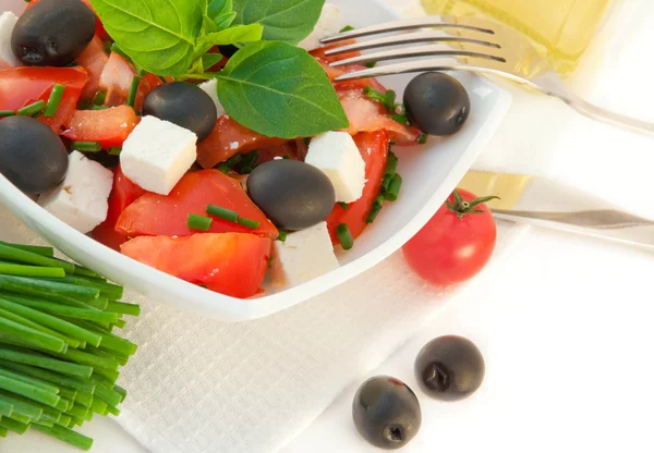 Salad from tomatoes, olives and the cow cheese — Stock Photo, Image