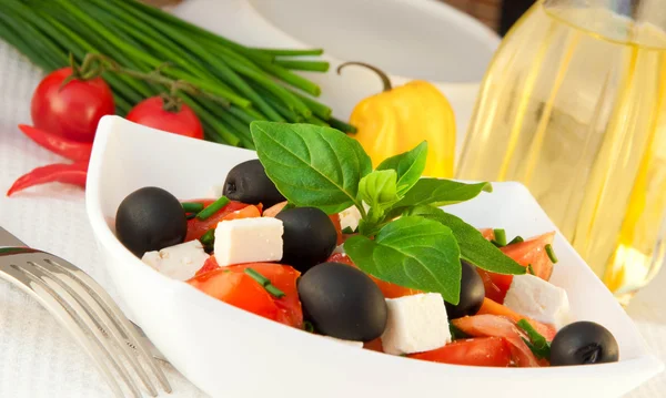 stock image Salad from tomatoes, olives and the cow cheese