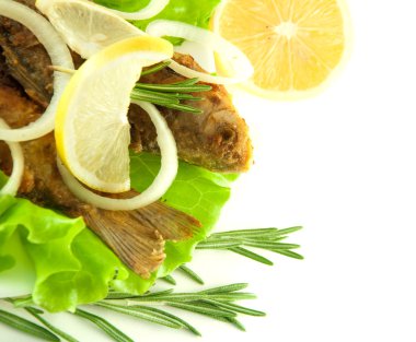 Fish fried, a crucian with a lemon, rosemary and olive oil