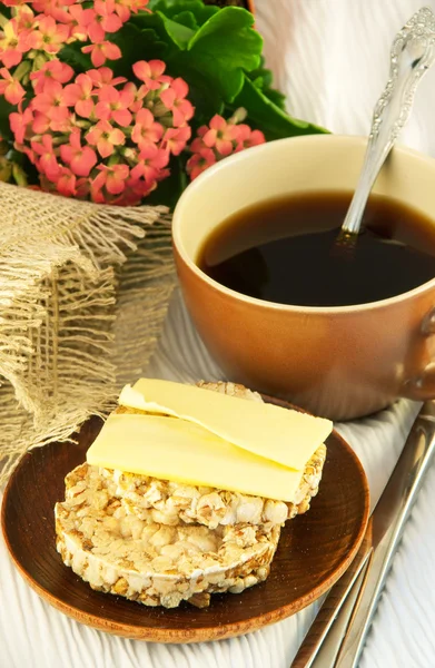 Crackling bread and butter and cup of coffee — Stock Photo, Image