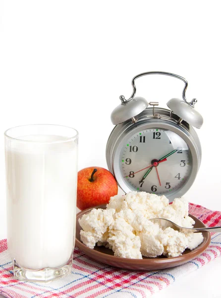 Milk, cottage cheese and alarm clock on the red napkin — Stock Photo, Image