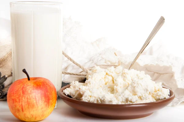 Milk, cottage cheese and apple on the red napkin — Stock Photo, Image
