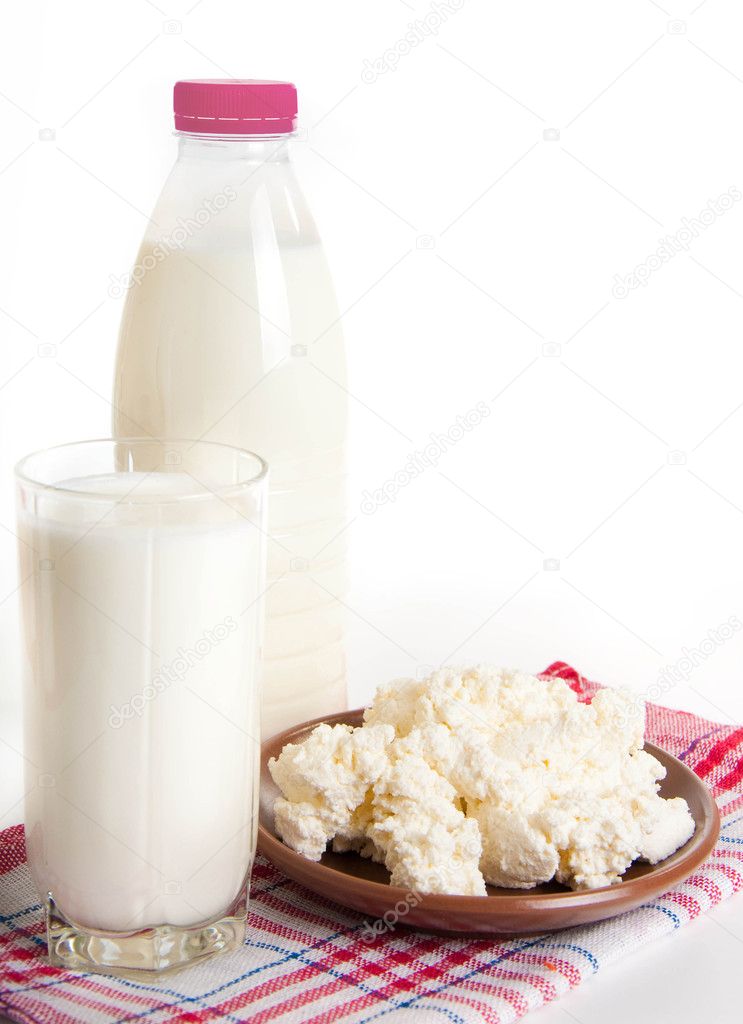 Milk and cottage cheese on the red napkin, a healthy breakfast