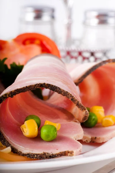 Bacon and boiled pork with peas and corn — Stock Photo, Image