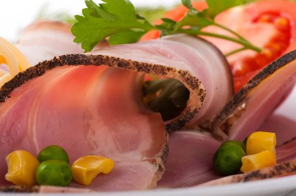 Bacon and boiled pork with peas and tomatoes — Stock Photo, Image
