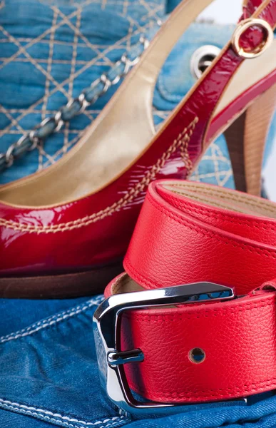 Red belt and shoes, a jeans bag and a skirt — Stock Photo, Image
