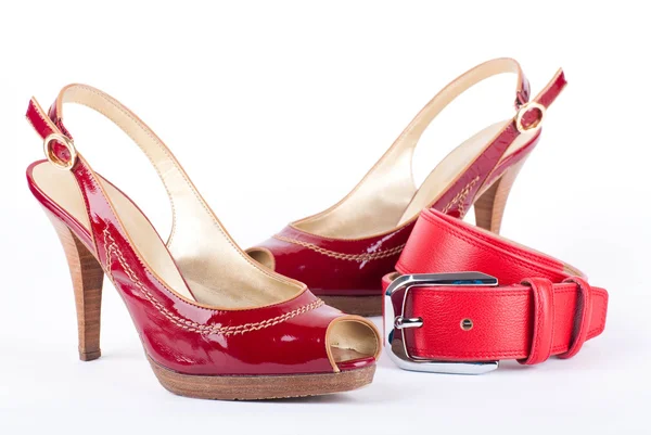 Red belt and shoes on a white background — Stock Photo, Image