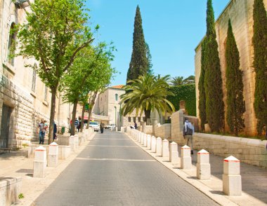 Ancient street in Nazareth, Israel. Date palm trees clipart