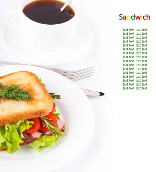 stock image Sandwich from smoked meat and tomatoes, a cup of coffee