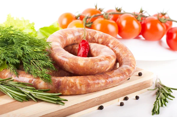 Sausage from pork and beef, tomatoes, salad and spices — Stock Photo, Image