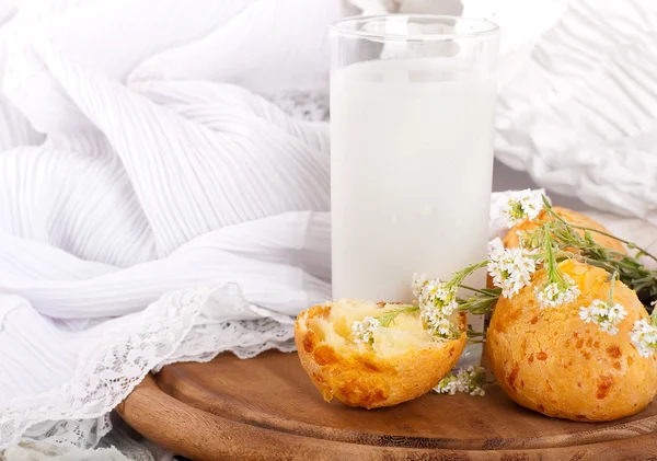 stock image Jug with milk, bread and wild flowers on a white background